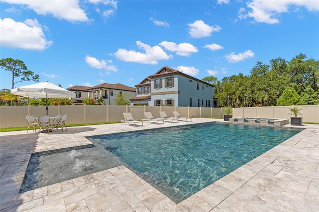 view of swimming pool featuring a patio