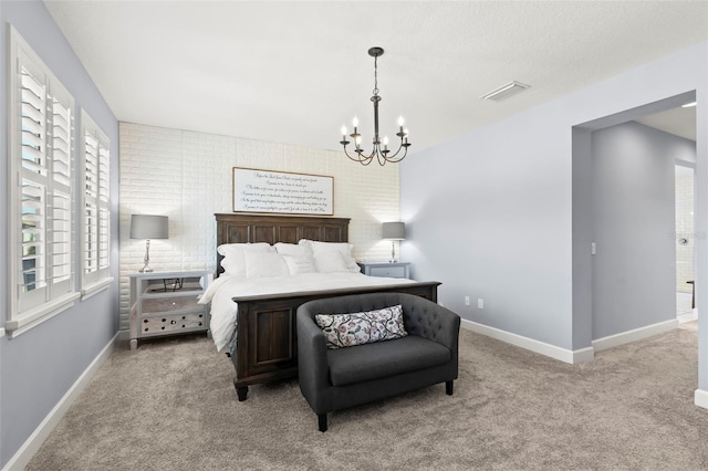 bedroom featuring light colored carpet, an inviting chandelier, and brick wall