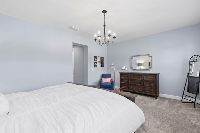 bedroom featuring a notable chandelier and light carpet