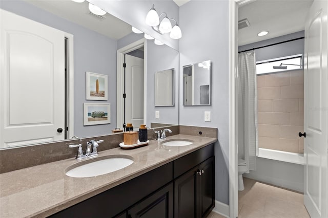 full bathroom featuring tile patterned floors, vanity, shower / bathtub combination with curtain, and toilet