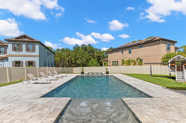 view of swimming pool with a patio