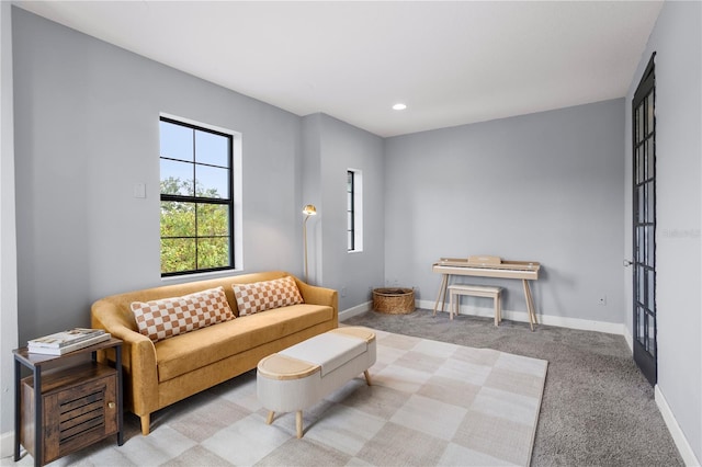 living room featuring french doors and light colored carpet