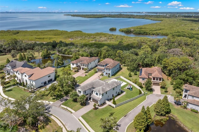 birds eye view of property with a water view