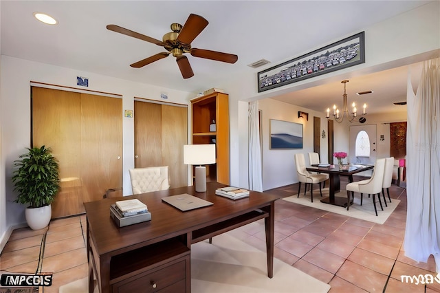 office with tile patterned flooring and ceiling fan with notable chandelier