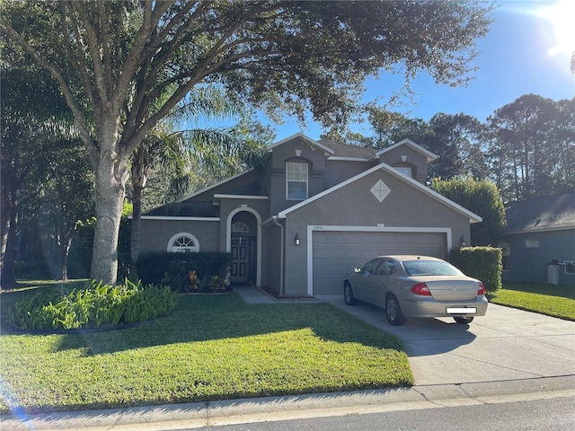 view of front property with a garage and a front lawn