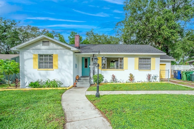 ranch-style home with a front yard