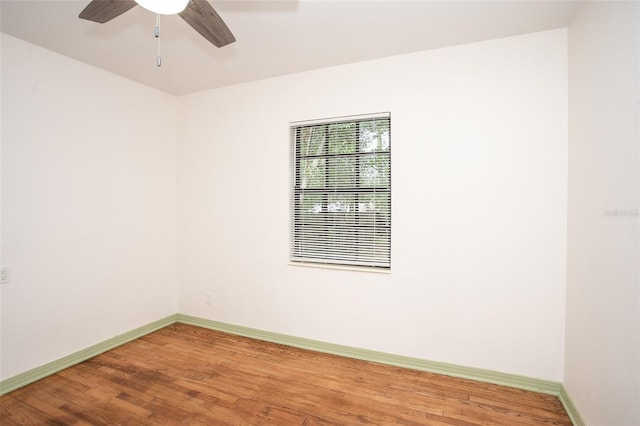 empty room with ceiling fan and wood-type flooring