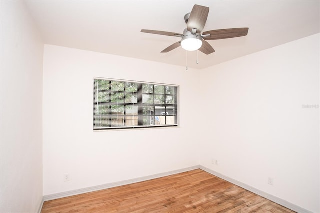 unfurnished room featuring ceiling fan and wood-type flooring