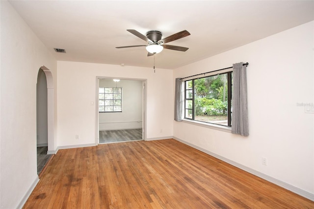 spare room featuring ceiling fan and hardwood / wood-style floors