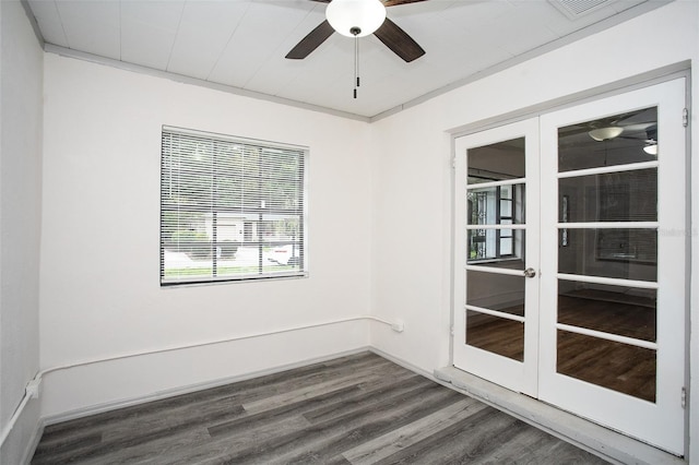 empty room featuring ceiling fan, french doors, and dark hardwood / wood-style floors