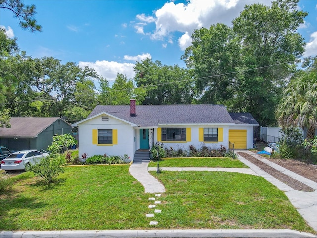 ranch-style home with a front lawn