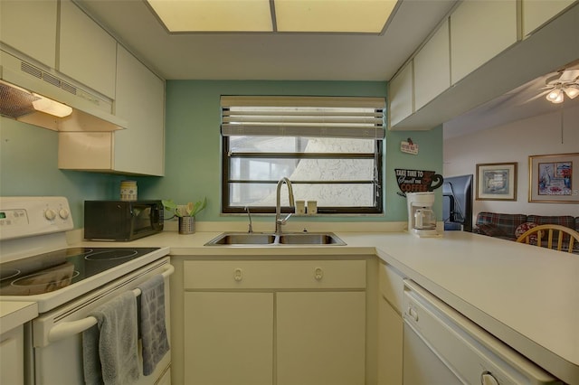 kitchen with sink, white cabinetry, ceiling fan, and white appliances