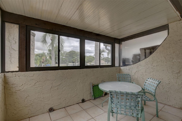 sunroom / solarium featuring wooden ceiling