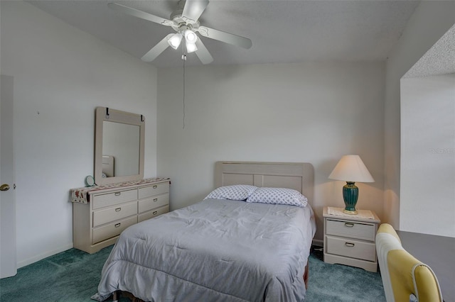 bedroom with ceiling fan, dark colored carpet, and vaulted ceiling