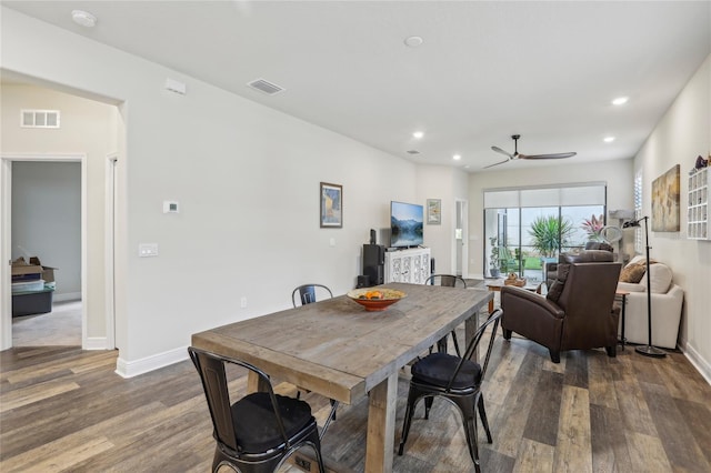 dining space featuring baseboards, wood finished floors, visible vents, and recessed lighting