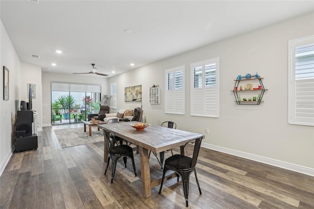 dining room with baseboards, dark wood-type flooring, visible vents, and recessed lighting