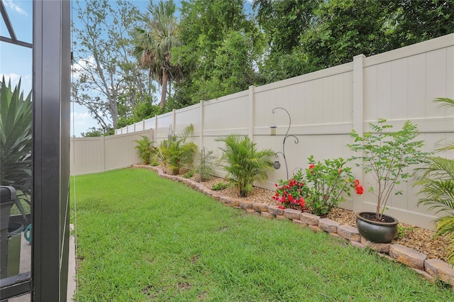 view of yard with a fenced backyard