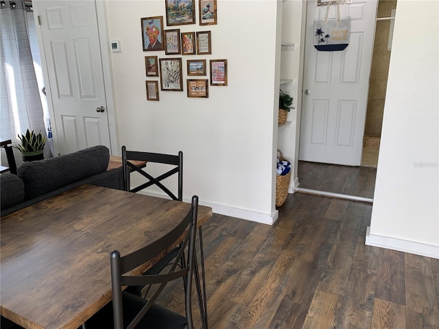 dining space featuring dark hardwood / wood-style floors