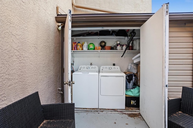 laundry area with washing machine and dryer