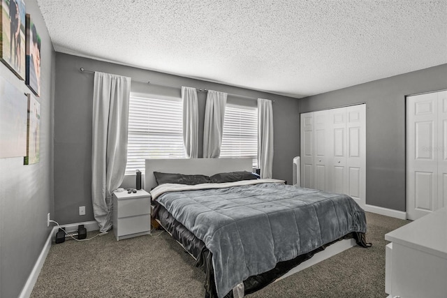 carpeted bedroom with a textured ceiling