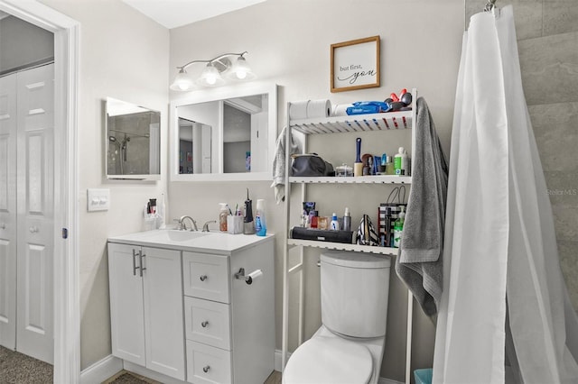 bathroom with walk in shower, vanity, and toilet