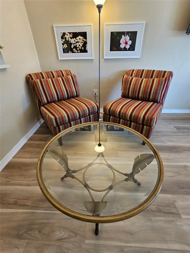 living area with hardwood / wood-style flooring