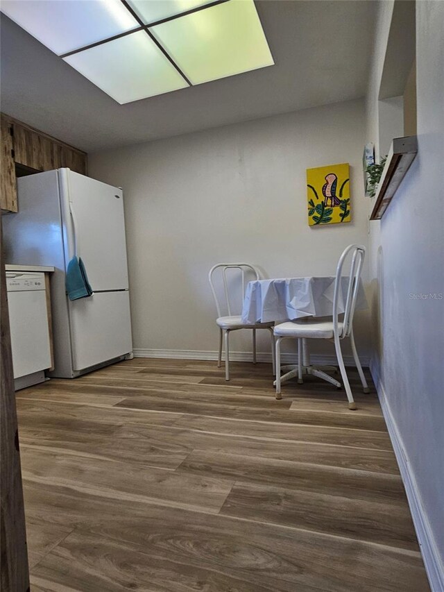 dining area with hardwood / wood-style flooring