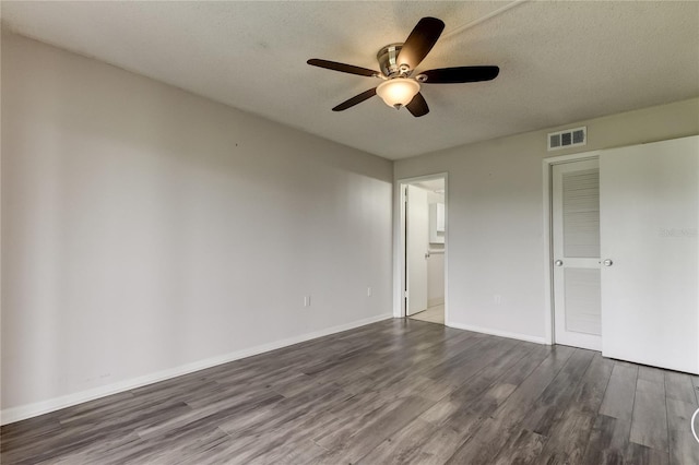 unfurnished bedroom featuring hardwood / wood-style floors, a textured ceiling, and ceiling fan