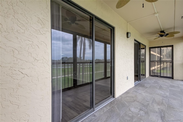 exterior space featuring ceiling fan