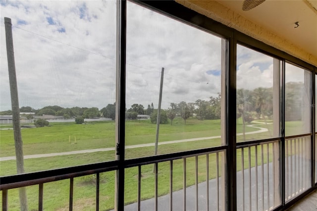 unfurnished sunroom with a water view