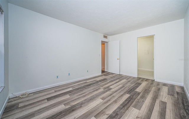 empty room featuring light hardwood / wood-style floors