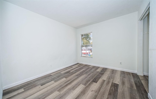 spare room featuring hardwood / wood-style flooring