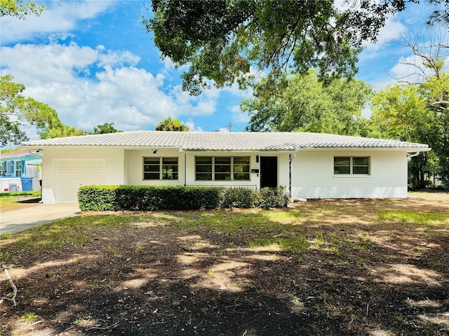 single story home with a garage