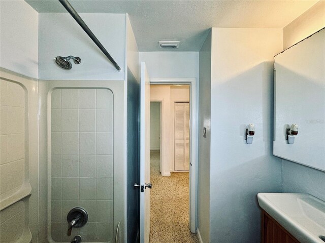 bathroom featuring vanity and tub / shower combination