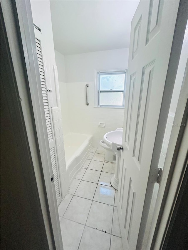 bathroom with tile patterned floors, shower with separate bathtub, and toilet