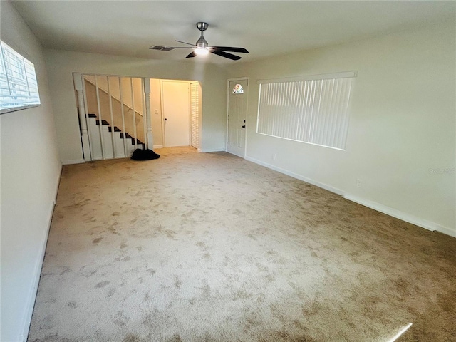 carpeted empty room with ceiling fan