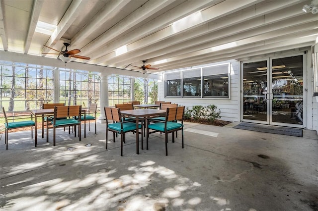 sunroom / solarium featuring ceiling fan