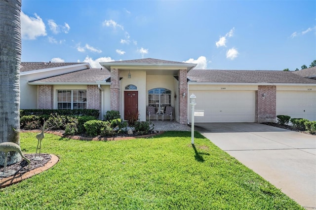 ranch-style house with a garage and a front lawn