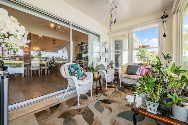 sunroom / solarium featuring a water view