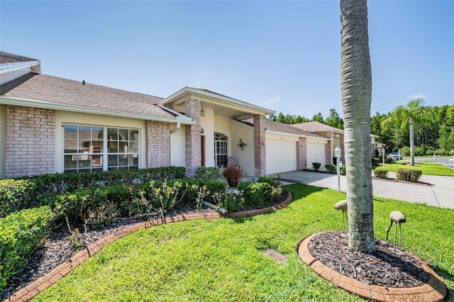 ranch-style home with a garage and a front yard