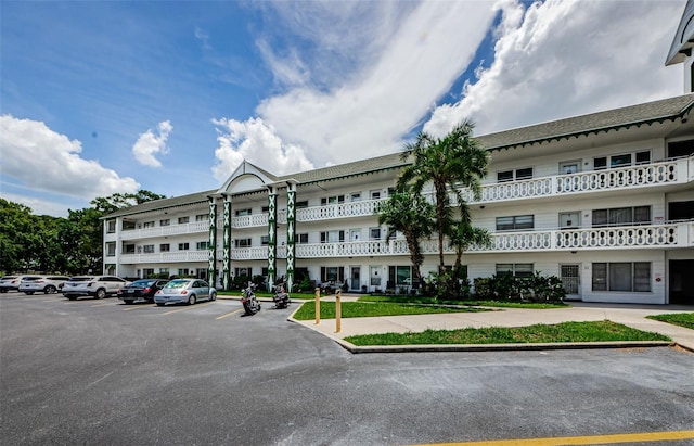 view of property with uncovered parking