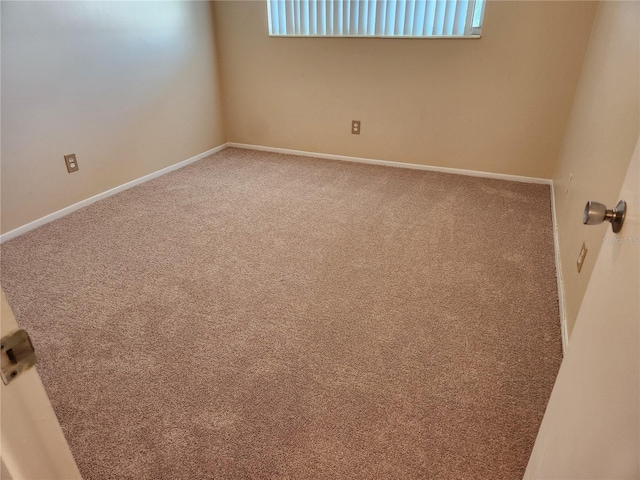 spare room with carpet floors