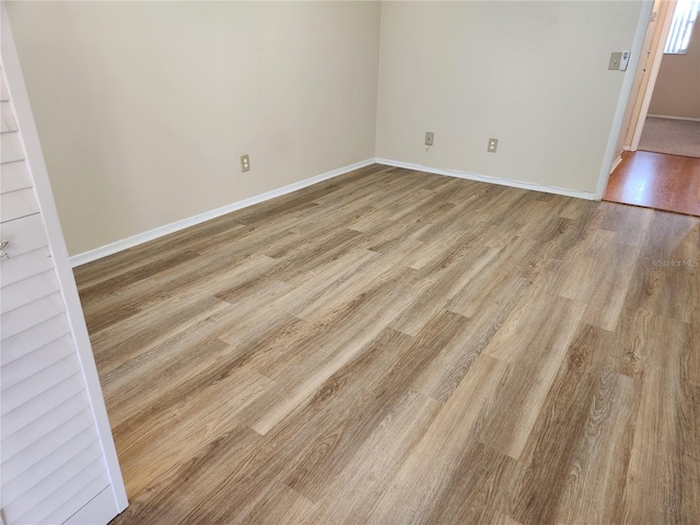 spare room featuring light hardwood / wood-style floors