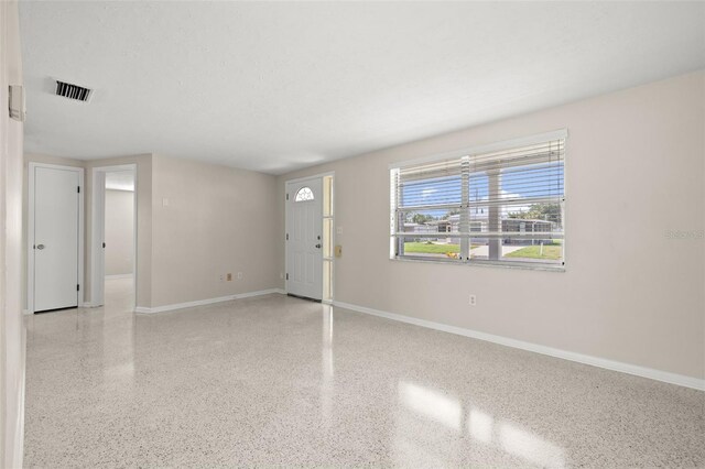 entrance foyer with a textured ceiling