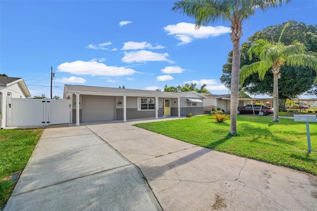 single story home featuring a garage and a front lawn