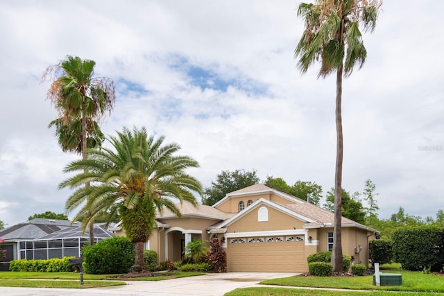 view of front of property with a garage and a front yard