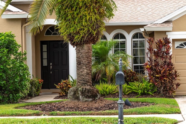 property entrance with a garage