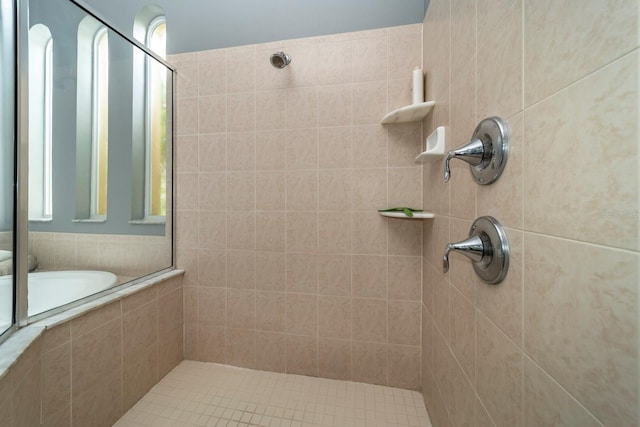 bathroom with tiled shower