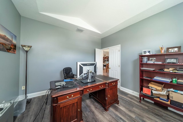 office with dark hardwood / wood-style floors and vaulted ceiling