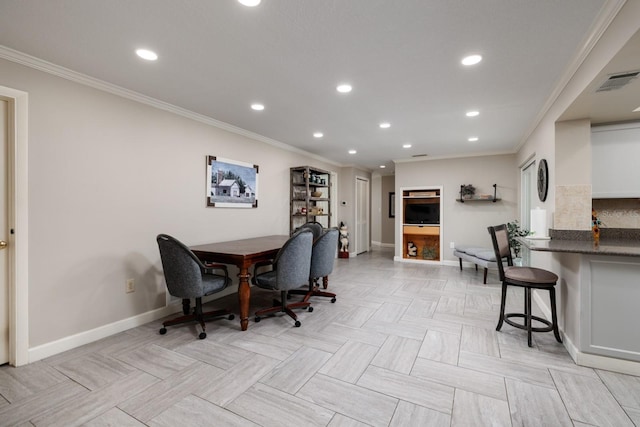 dining space with crown molding and light parquet floors